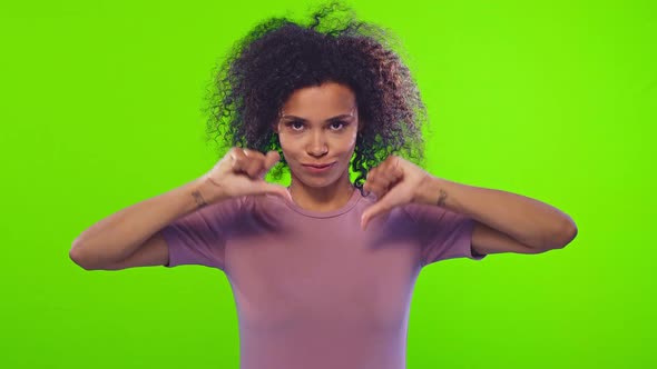 Black Woman Showing Thumbs Down Gesture, Negative Feedback Over Chroma Key alt