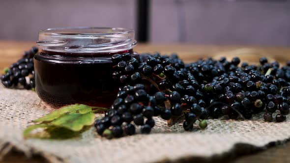 Natural Elderberry Juice. Black Elderberry On A Wooden Background. Herbal Medicine. Homeopathy