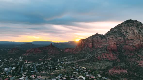 Sedona Desert Town And The Iconic Cathedral Rocks During Golden Hour In Arizona. Aerial Wide Shot alt