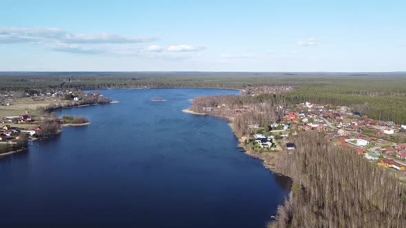 Aerial View of the Lake Borisovskoye, the Forest and the Settlement in Autumn Day, Borisovo