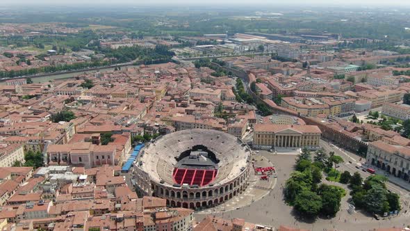 Flying over Arena - Roman amphitheatre in Verona city, Italy, Europe alt