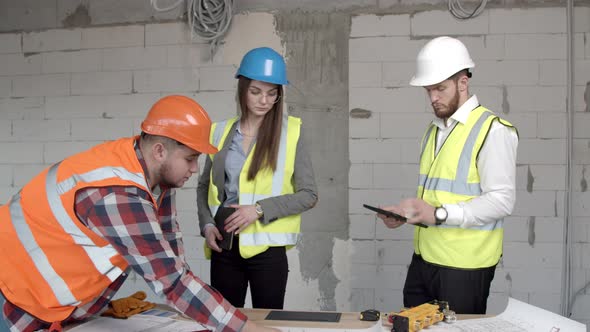 Young Architects Having Discussion on Construction Site