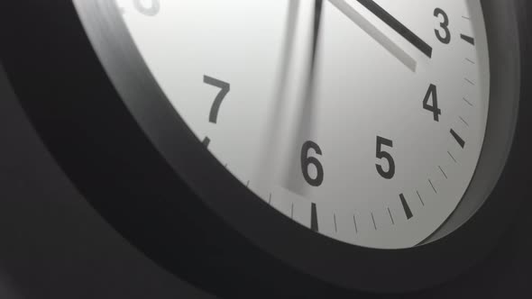 Clock Face In Time Lapse On Dark Grey Wall 