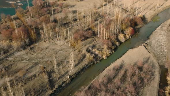 Aerial View Along Road Beside River In Ghizer Valley District In Pakistan. Dolly Forward Phander val alt