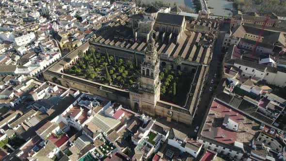 Aerial tilt-up reveal of historic landmark Mezquita-Catedral de Córdoba