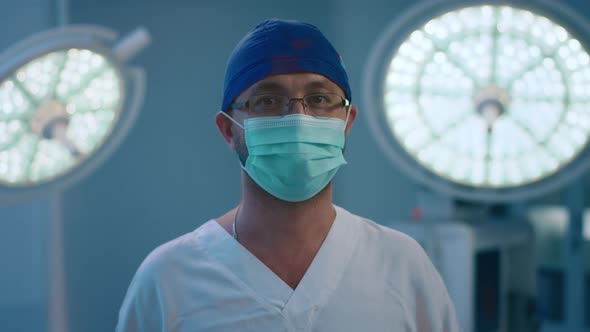 A Male Doctor Standing in a Surgery Room Wearing