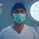 A Male Doctor Standing in a Surgery Room Wearing - VideoHive Item for Sale