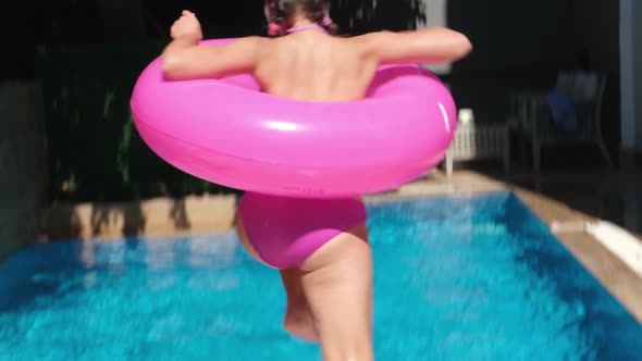 Teen Girl Playing and Having Fun in Swimming Pool