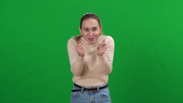 Happy Young Beautiful Slim Woman Expressing Positive Feelings at Chromakey Background alt