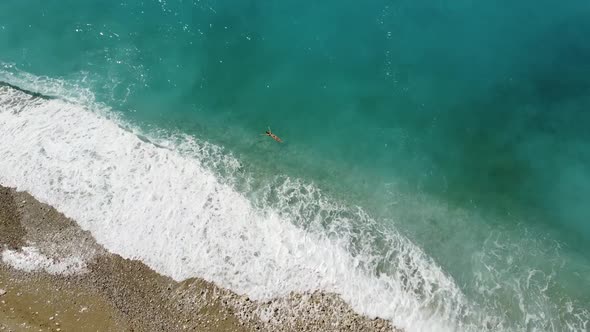 Young brunette enjoying the Paradise Beach, the most amazing beach around the Mediterranean, Turkey, alt