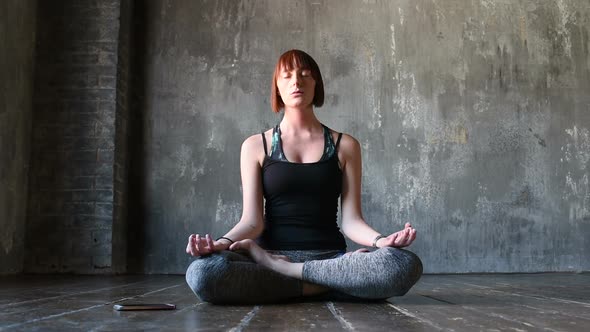 young beautiful woman indoor doing yoga alt
