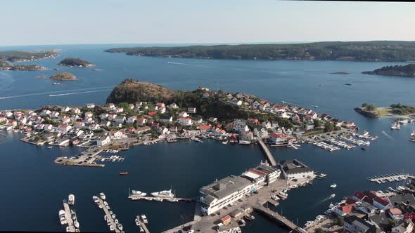 Aerial pan showing idyllic Kragero coastal town's marina, Southern Norway alt