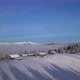 Flight Over Wooden Houses in Mountains in Winter - VideoHive Item for Sale