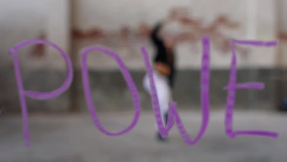 Cool female dancer performing to hashtag power