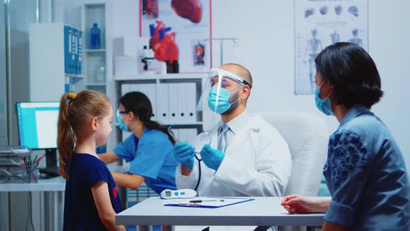 Doctor Examining Girl By Stethoscope alt