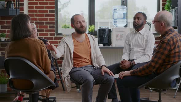 Man Doing Handshake with People Applauding to Celebrate Therapy Progress at Aa Meeting alt