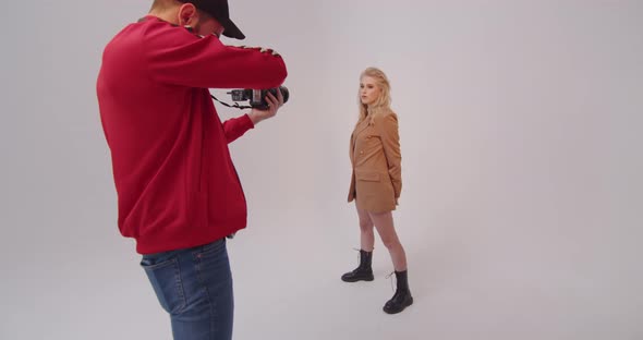 Photographer Working With A Model In The Studio