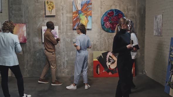 Visitors in Modern Art Gallery alt