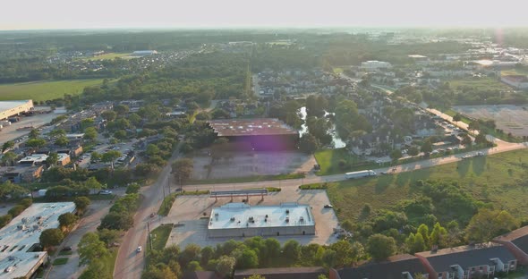 Aerial View of Residential Houses and Driveways Neighborhood During a Fall Sunset in Houston Texas alt