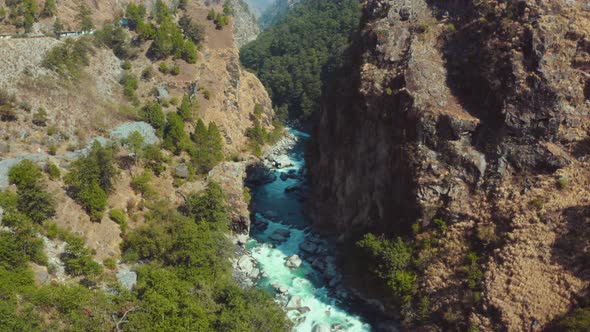 Beautiful Bhagirathi River flowing mid of two huge mountain rocks in Uttarkashi, Uttarakhand, India
