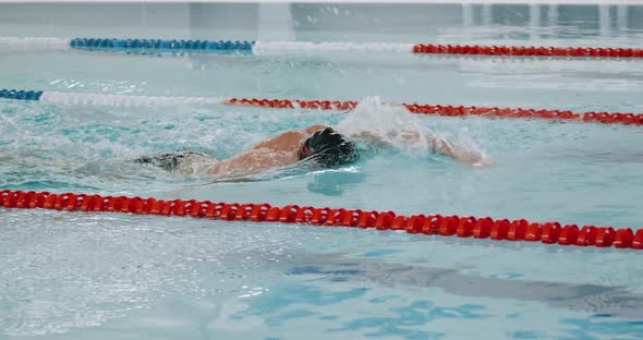 Young Athletic Man Swimmer Swims in the Pool, Man Swimming and Training in the Water, Slow Motion alt
