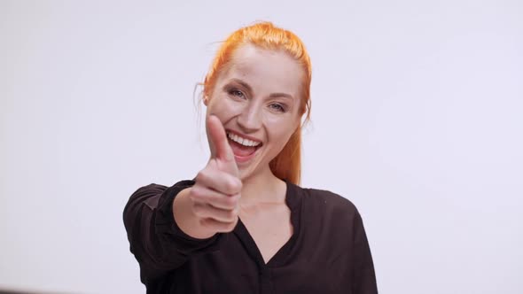 Joyful Caucasian Middleaged Woman with Colored Orange Hair Smiling Laughing at Camera on White alt