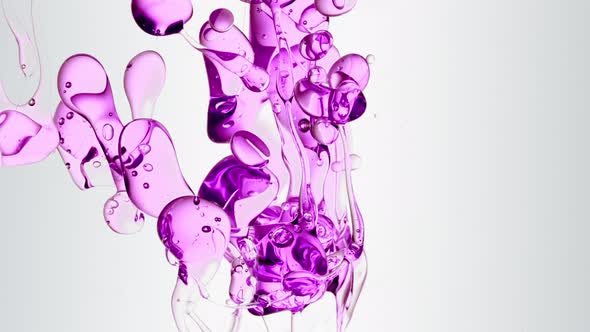 Transparent Cosmetic Purple Oil Bubbles And Shapes On White Background