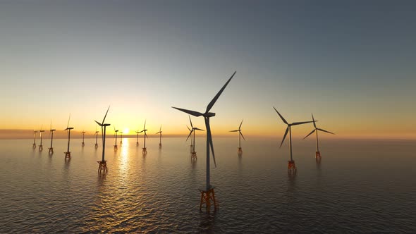 Offshore wind turbines spinning around at the sun setting marine background.