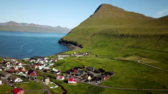 Aerial View of Gjogv Village and Tyril Mountain in Faroe Islands alt