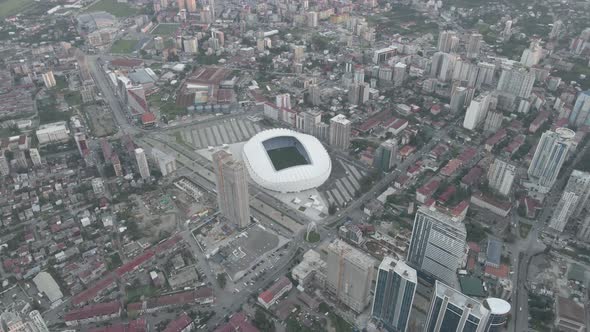 Aerial shot of Dinamo Batumi Stadium near Heroes Square against cityscape alt