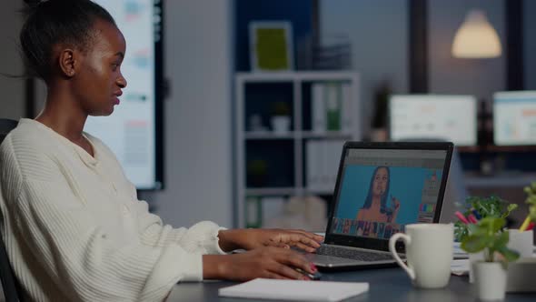 Black Woman Photo Retoucher Working on Laptop at New Project alt
