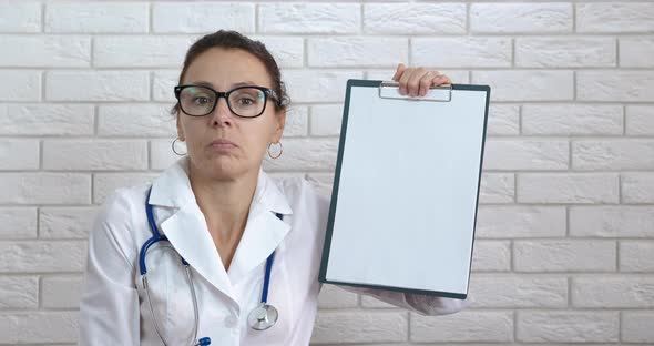 Doctor make notes on paper. alt