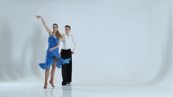 Couple of Graceful Dancers Perform Latino on White Background, Shadow alt