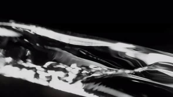 Super Slow Motion Shot of Flowing Water at 1000Fps Isolated on Black Background. alt