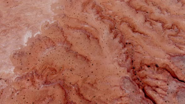 Drone shot looking down at Badlands then looking up to Monument Valley alt