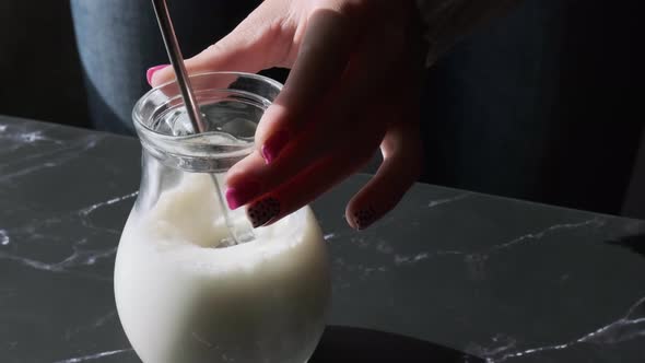 Beat the Milk in a Mug Using a Frother alt