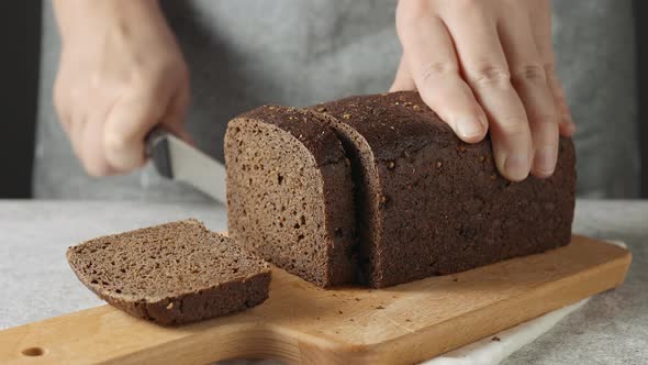 A man cuts the bread