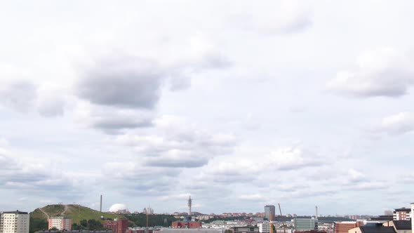Apartment and industrial buildings of Nacka district in Stockholm city, aerial tilt down shot alt