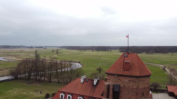 Drone View of a Flag Looming on Top of the Fortress