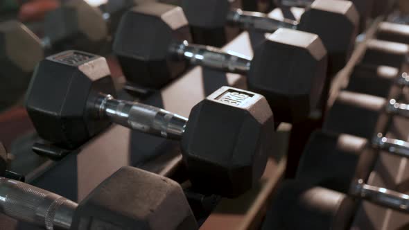 Rows of dumbbells in the gym. gym interior with equipment. sports and healthcare concept.