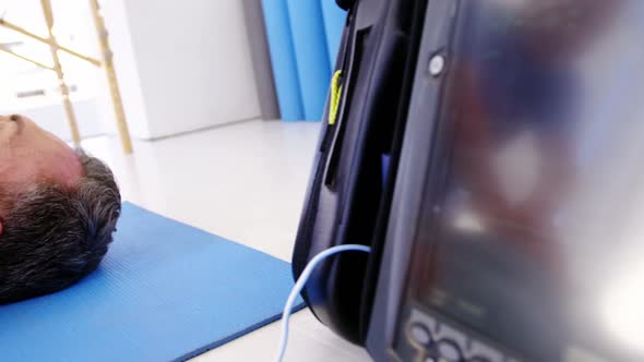 Male paramedic during cardiopulmonary resuscitation alt