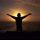 Man raising his arms against the sunset - VideoHive Item for Sale