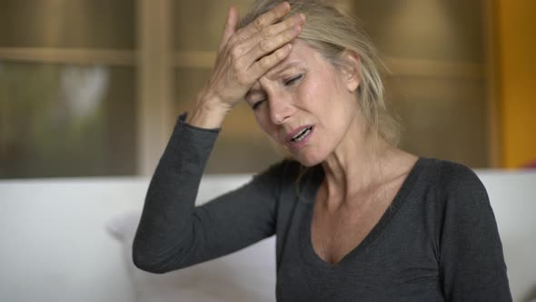 Mature woman suffering from a headache