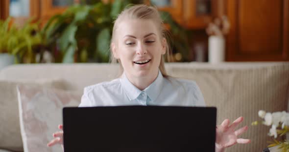 Smiling Woman Working on Laptop at Home Office. Businesswoman Typing on Computer Keyboard. alt