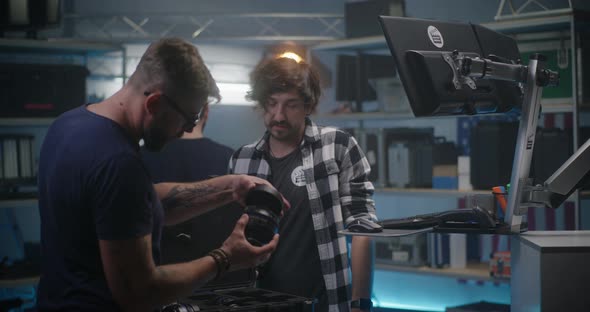 Costumer Check Lens in Video Equipment Store alt