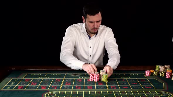 Handsome Guy Puts a Bet in the Casino. Black alt