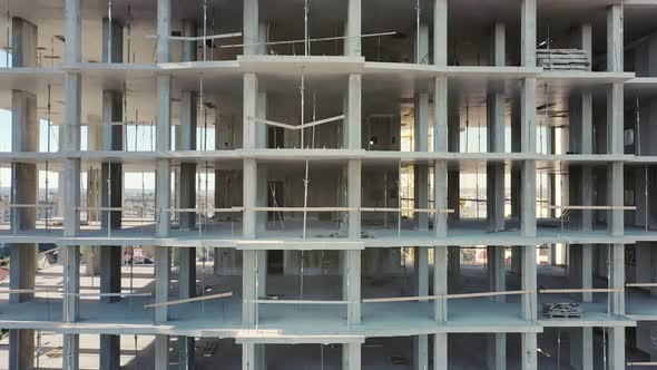 Aerial view of high residential apartment building under construction. Real estate development. alt