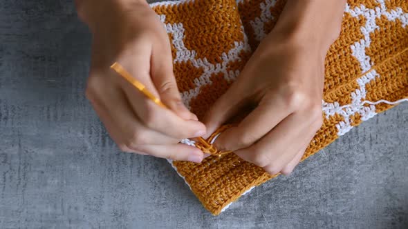 adult girls hands crochet hook
