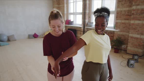 Young Afro Woman Having Private Dance Lesson with Female Teacher alt