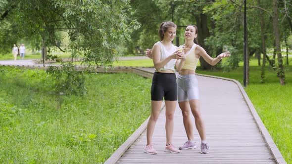 Sportswomen Make Selfie on Empty Wooden Track in Garden